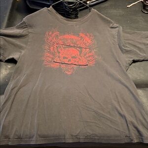 Stranded Black Tee with Red Skull Graphic